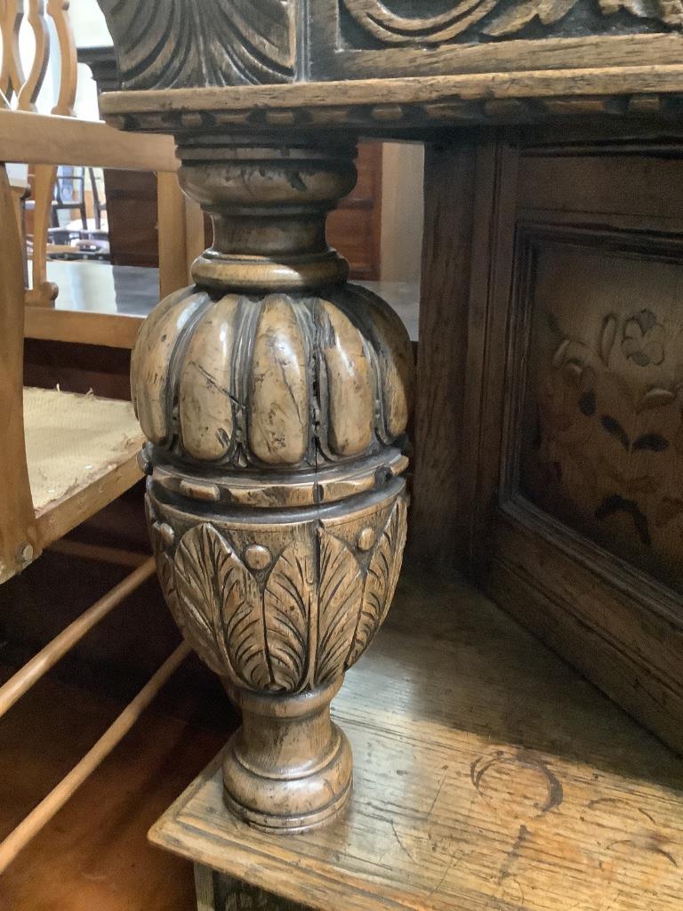 A reproduction 17th century style marquetry inlaid oak court cupboard, length 122cm, depth 43cm, height 155cm